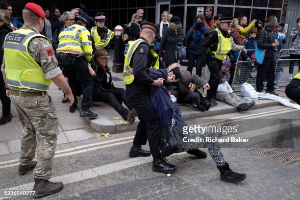 Military Police assist Police officers to arrest Climate Change activists as they disrupted the progress of newly-elected Lord Mayor of London, on...