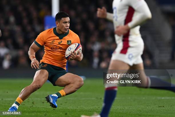 Australia's centre Len Ikitau makes a break during the Autumn International friendly rugby union match between England and Australia at Twickenham...