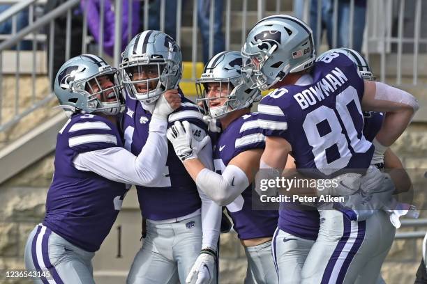 Defensive back Marvin Martin of the Kansas State Wildcats celebrates with his teammates after recovering a blocked punt for a touchdown against the...