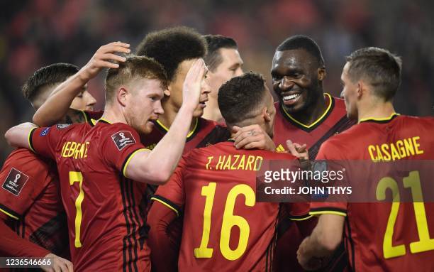 Belgium's players celebrate after Belgium's midfielder Thorgan Hazard scored a goal during the FIFA World Cup 2022 qualification football match...