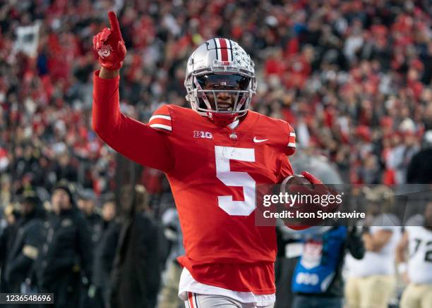 Ohio State Buckeyes wide receiver Garrett Wilson celebrating as he runs with the ball during the game between the Ohio State Buckeyes and the Purdue...