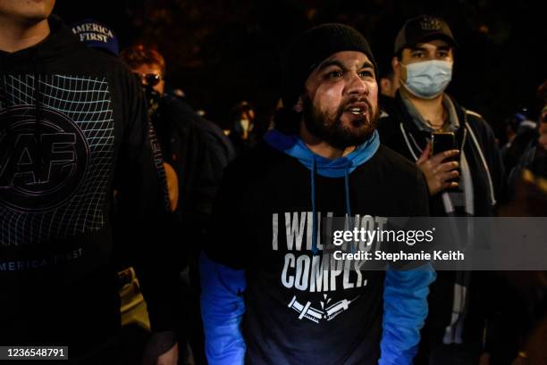 People associated with the far-right group America First attend an anti-vaccine protest in front of Gracie Mansion and are confronted by Antifa on...