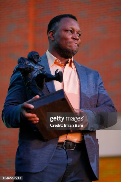 Barry Sanders acknowledges fans after a statue was unveiled in his honor by the Oklahoma State Cowboys at Boone Pickens Stadium on November 13, 2021...