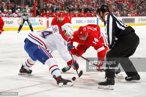 Nick Suzuki of the Montreal Canadiens beats Robby Fabbri of the Detroit Red Wings on a face-off during the first period of an NHL game at Little...