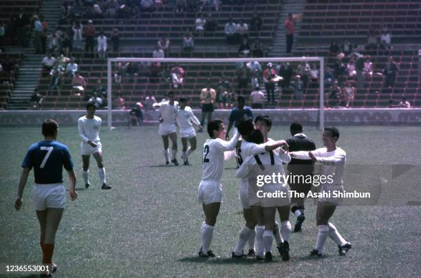 Kunishige Kamamoto of Japan celebrates scoring his side's second goal with his team mates during the Football Quarter-Final match between Japan and...