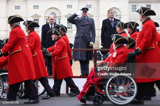 Prince William, Duke of Cambridge salutes veterans from the Chelsea Pensioners as they march past during the National Service Of Remembrance at Horse...