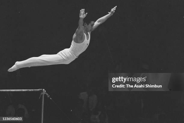 Sawao Kato of Japan competes in the Horizontal Bar of the Artistic Gymnastics Men's Individual All-Around final during the Mexico City Summer Olympic...