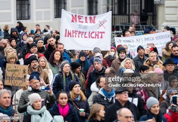 Demonstrator holds a placard reading 'No to compulsory vaccination' during an anti-vaccination protest at the Ballhausplatz in Vienna, Austria, on...