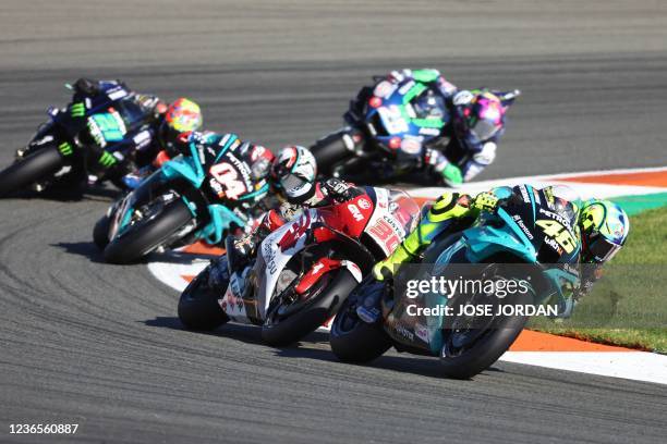 Petronas Yamaha SRT Italian rider Valentino Rossi rides ahead LCR Honda Idemitsu Japanese rider Takaaki Nakagami and Petronas Yamaha SRT Italian...