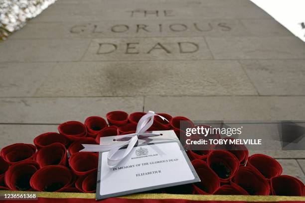 Message from Britain's Queen Elizabeth is seen in detail on a wreath beside The Cenotaph following the Remembrance Sunday ceremony on Whitehall in...
