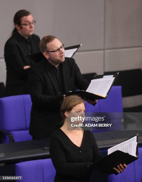 Choir performs during a special session of the German parliament to mark the national day of mourning at the Bundestag, the lower house of...