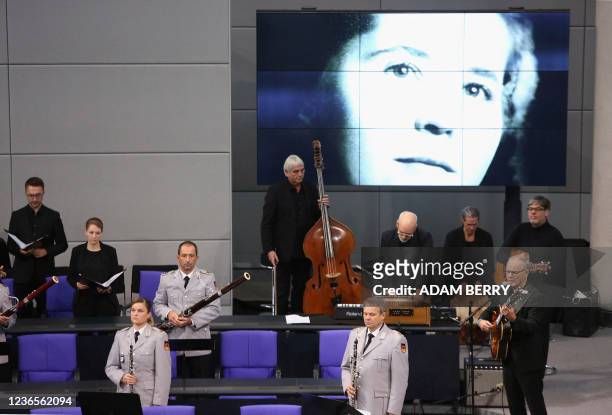 Reinhold Beckmann and his band perform during a special session of the German parliament to mark the national day of mourning at the Bundestag, the...