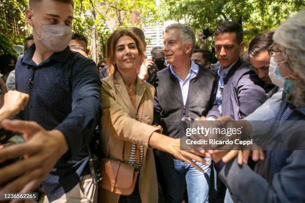 Former president of Argentina Mauricio Macri arrives with wife Juliana Awada to cast his vote during legislative midterm elections at Wenceslao Posse...