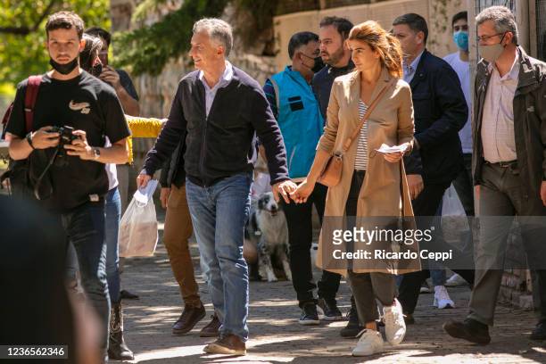 Former president of Argentina Mauricio Macri arrives with wife Juliana Awada to cast his vote during legislative midterm elections at Wenceslao Posse...