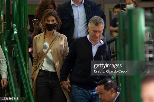 Former president of Argentina Mauricio Macri arrives with wife Juliana Awada to cast his vote during legislative midterm elections at Wenceslao Posse...