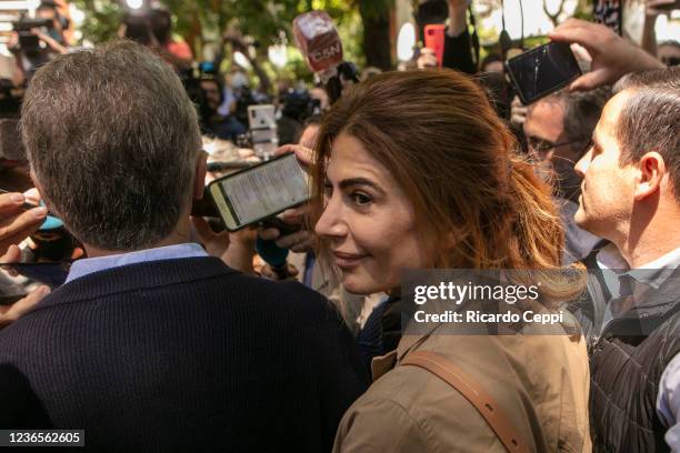 Juliana Awada walks with husband former president of Argentina Mauricio Macri as they arrive to cast their vote during legislative midterm elections...