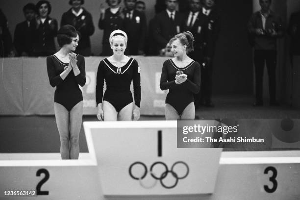 Silver medalist Zinaida Voronina of the Soviet Union, gold medalist Vera Caslavska of Czechoslovakia and bronze medalist Natalia Kuchinskaya of the...