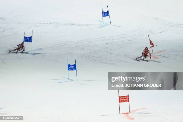 Austria's Dominik Raschner and Austria's Christian Hirschbuhl compete in the men's parallel slalom of the FIS ski alpine world cup in Lech, Austria...