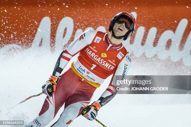 Austria's Dominik Raschner celebrates after the men's parallel slalom of the FIS ski alpine world cup in Lech, Austria on November 14, 2021. -...