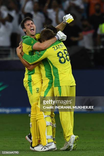 Australia's Mitchell Marsh celebrates their win with teammates at the end of the ICC mens Twenty20 World Cup final match between Australia and New...