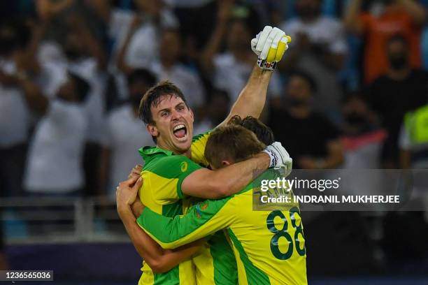 Australia's Mitchell Marsh celebrates their win with teammates at the end of the ICC mens Twenty20 World Cup final match between Australia and New...