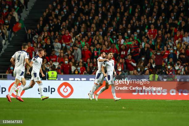 Dusan Tadic of Serbia celebrates after scoring a goal during the 2022 FIFA World Cup Qualifier match between Portugal and Serbia at Estadio Jose...