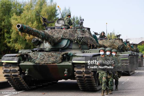 Tanks are deployed to carry out a shore defense operation as part of a military exercise simulating the defense against the intrusion of Chinese...