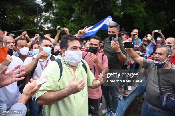 Demonstrator argues with pro-government supproters at El Quijote park in Havana, where opposition actor and playwright Yunior Garcia was expected to...