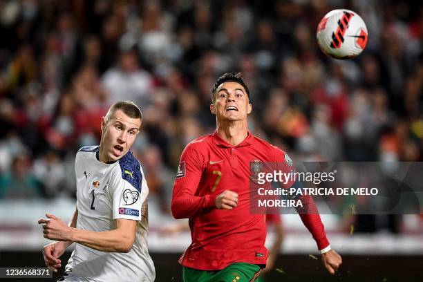 Serbia's defender Strahinja Pavlovic fights for the ball with Portugal's forward Cristiano Ronaldo during the FIFA World Cup Qatar 2022 qualification...