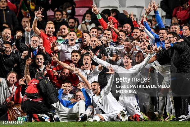 Serbia's players celebrate at the end of the FIFA World Cup Qatar 2022 qualification group A football match between Portugal and Serbia, at the Luz...