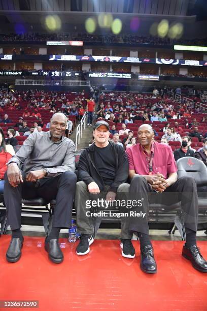 Houston Rockets legends, Hakeem Olajuwon and Elvin Hayes attend the game against the Phoenix Suns with Houston Rockets owner, Tilman Fertitta on...