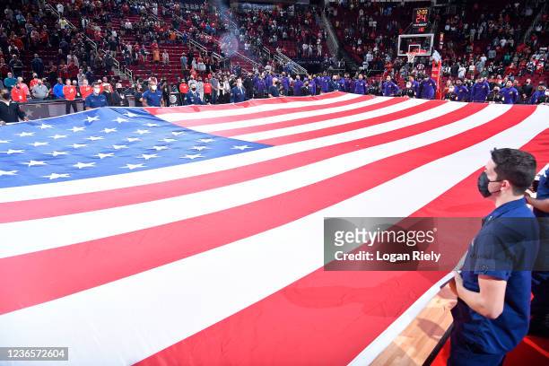 The American Flag is spread across the court for the National Anthem before the game between the Houston Rockets and the Phoenix Suns on November 14,...