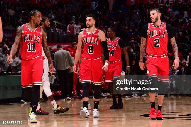 DeMar DeRozan, Zach LaVine, and Lonzo Ball of the Chicago Bulls looks on during the game against the LA Clippers on November 14, 2021 at STAPLES...