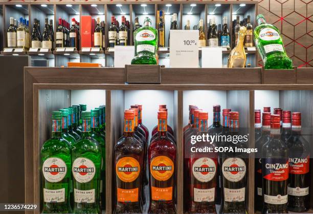 Vermouth Martini and Cinzano seen displayed on a shelf of a Duty Free store at Boryspil International Airport.