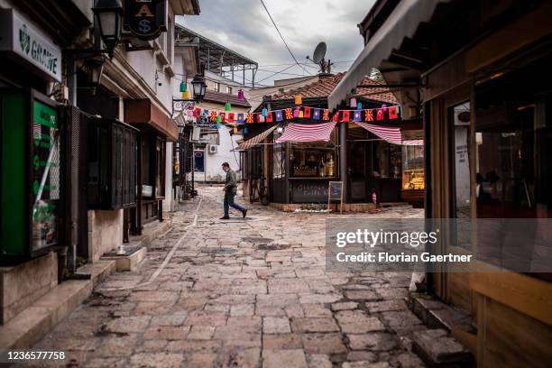 People walking through the Old Bazar are pictured on October 16, 2021 in Skopje, North Macedonia.