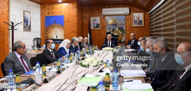 Palestinian Prime Minister Mohammad Shtayyeh holds the weekly cabinet meeting in Jerusalem on November 15, 2021. The weekly cabinet meeting was held...