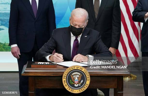 President Joe Biden signs an executive order to help improve public safety and justice for Native Americans during a Tribal Nations Summit in the...