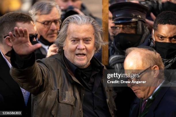 Former Trump Administration White House advisor Steve Bannon waves after speaking to the press on his way out of federal court on November 15, 2021...