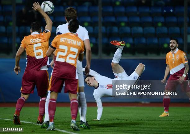 England's midfielder Phil Foden shoots on target during the FIFA World Cup Qatar 2022 qualification Group I football match between San Marino and...