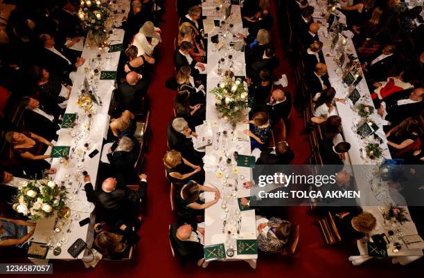 Attendees listen to a speaker during the Lord Mayor's Banquet in central London on November 15, 2021. - The Lord Mayor's Banquet is held in honour of...