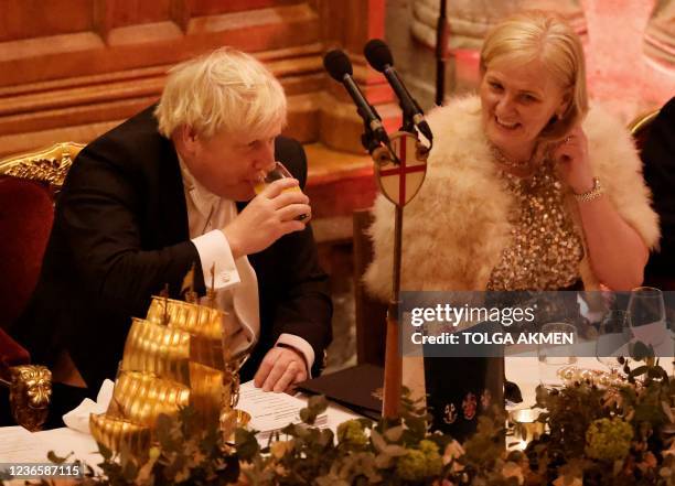 Britain's Prime Minister Boris Johnson takes a drink as he attends the Lord Mayor's Banquet in central London on November 15, 2021. - The Lord...