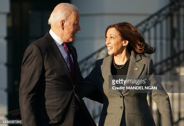 President Joe Biden and US Vice President Kamala Harris arrive during a signing ceremony for H.R. 3684, the Infrastructure Investment and Jobs Act on...