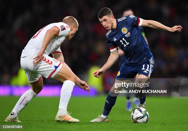 Denmark's defender Rasmus Nissen vies with Scotland's striker Ryan Christie during the FIFA World Cup 2022 Group F qualification football match...