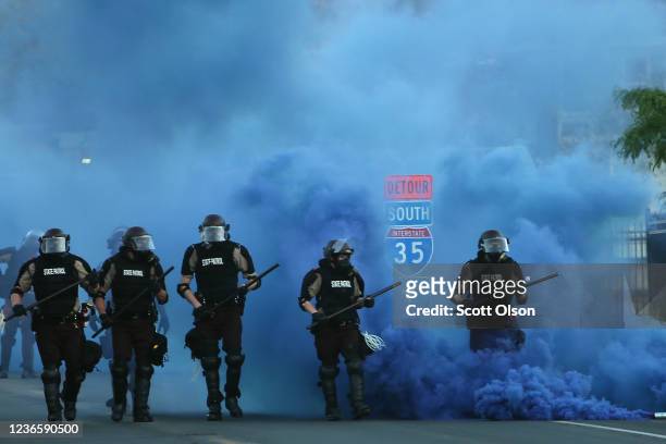 Police advance on demonstrators who are protesting the killing of George Floyd on May 30, 2020 in Minneapolis, Minnesota. Former Minneapolis police...