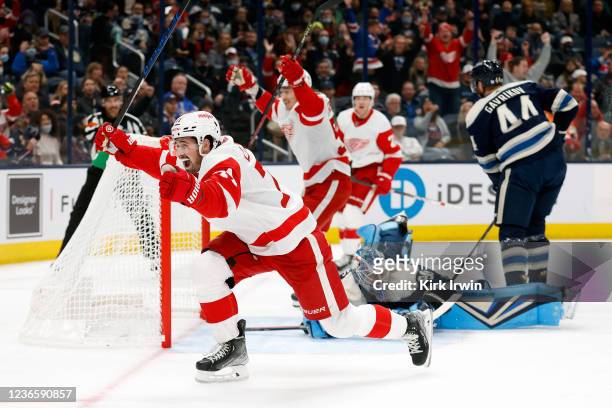 Dylan Larkin of the Detroit Red Wings reacts after beating Elvis Merzlikins of the Columbus Blue Jackets for a goal during the first period at...