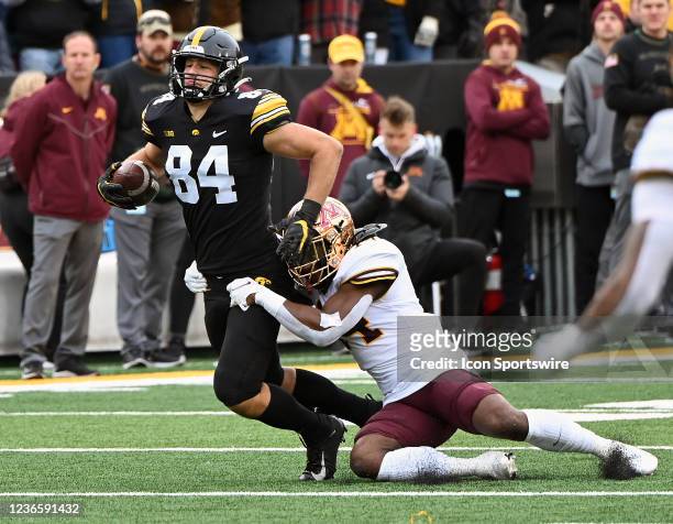 Minnesota linebacker Braelen Oliver tackles Iowa tight end Sam LaPorta after a pass reception during a college football game between the Minnesota...