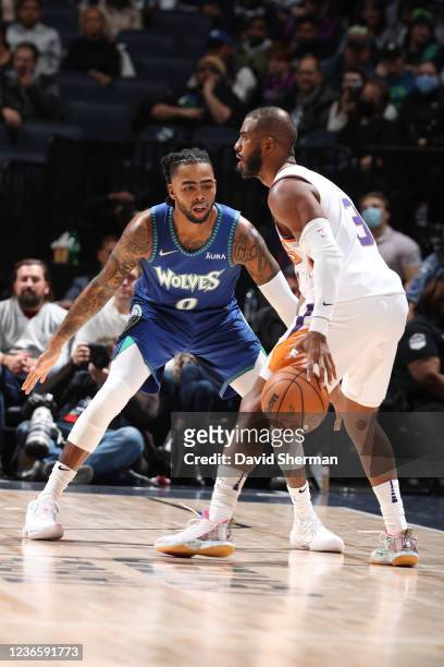 Angelo Russell of the Minnesota Timberwolves defends against Chris Paul of the Phoenix Suns on November 15, 2021 at Target Center in Minneapolis,...