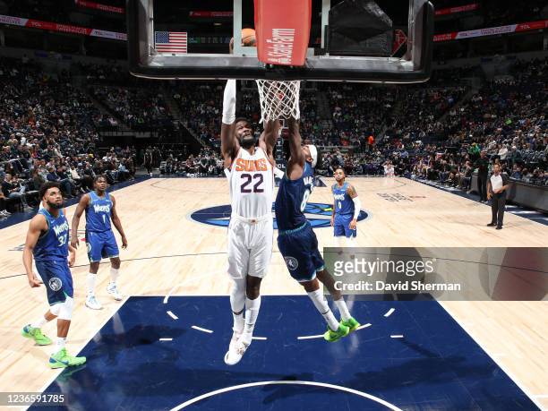 Deandre Ayton of the Phoenix Suns drives to the basket against the Minnesota Timberwolves on November 15, 2021 at Target Center in Minneapolis,...