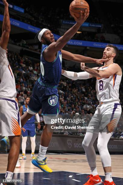 Josh Okogie of the Minnesota Timberwolves drives to the basket against the Phoenix Suns on November 15, 2021 at Target Center in Minneapolis,...