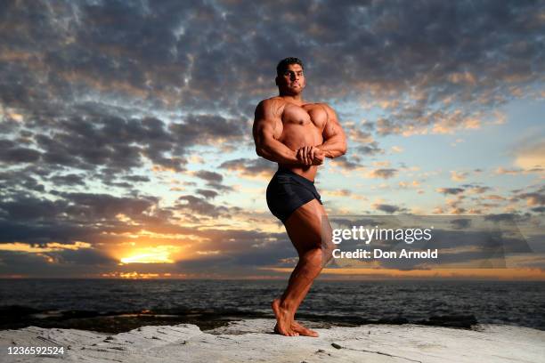 Chris Kavvalos poses during an early morning photo shoot at Little Bay on May 31, 2020 in Sydney, Australia. IFBB body builder Chris Kavvalos has...